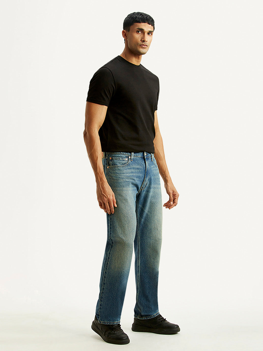 Men's 555 Blue Relaxed Straight Fit Mid Rise Tinted Jeans - Side View