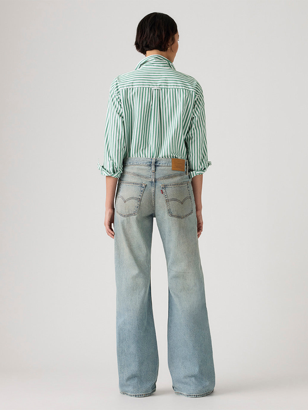 Women's Tinted Med Indigo Loose Bootcut Fit Mid Rise Jeans - Back View