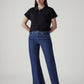 Women's Med Indigo Loose Bootcut Fit Mid Rise Jeans - Styleshot View